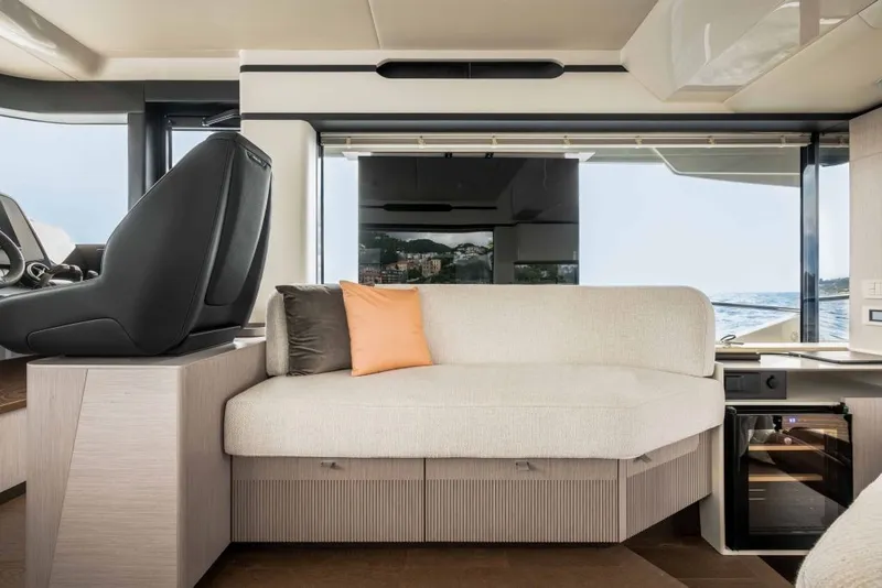 Slide: The Image of Interior of the 2028 Absolute Navetta 50 with a stylish seating area and sea view. - 9