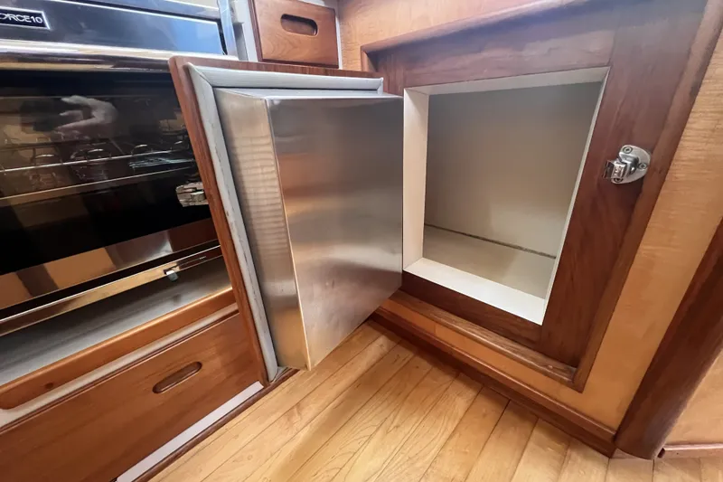 Slide: The Image of Stainless steel refrigerator in a 1991 Perry 51 yacht kitchen. - 59