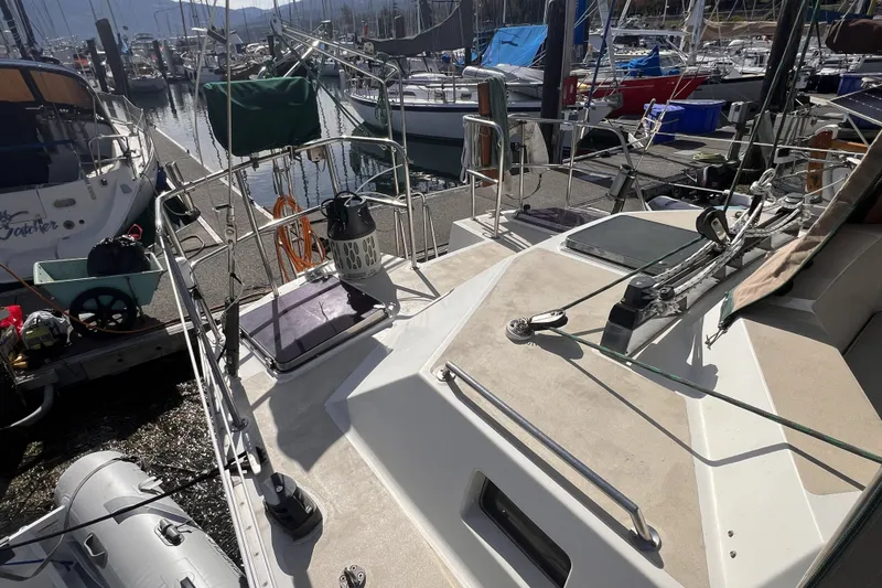 Slide: The Image of Sailboat docked at marina, Perry 51 model, 1991, with visible deck and rigging. - 19