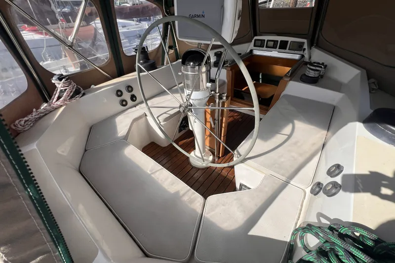 Slide: The Image of Cockpit of 1991 Perry 51 sailboat with steering wheel and navigation equipment. - 40