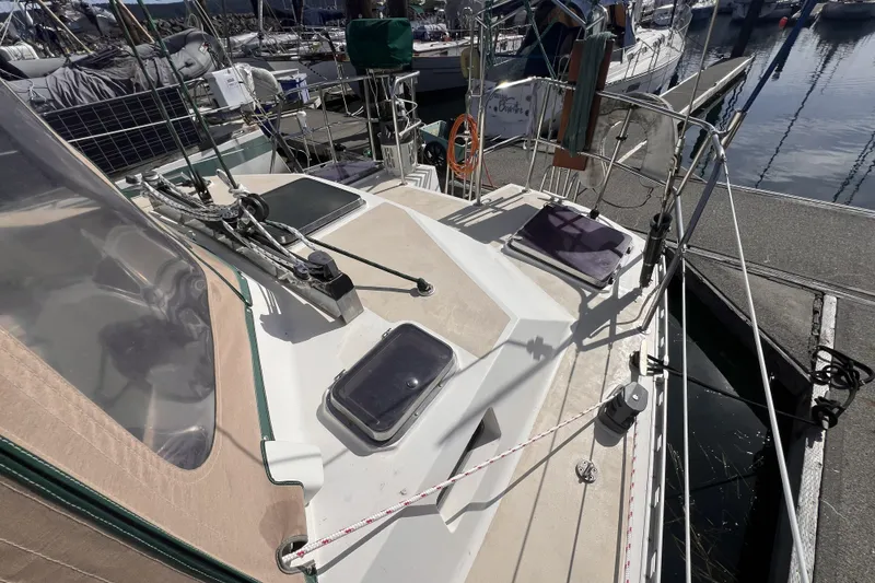 Slide: The Image of Deck view of a 1991 Perry 51 sailboat docked at a marina. - 20