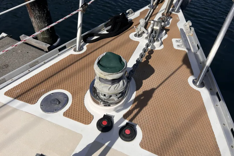 Slide: The Image of Bow of 1991 Perry 51 sailboat with anchor chain and winch. - 15