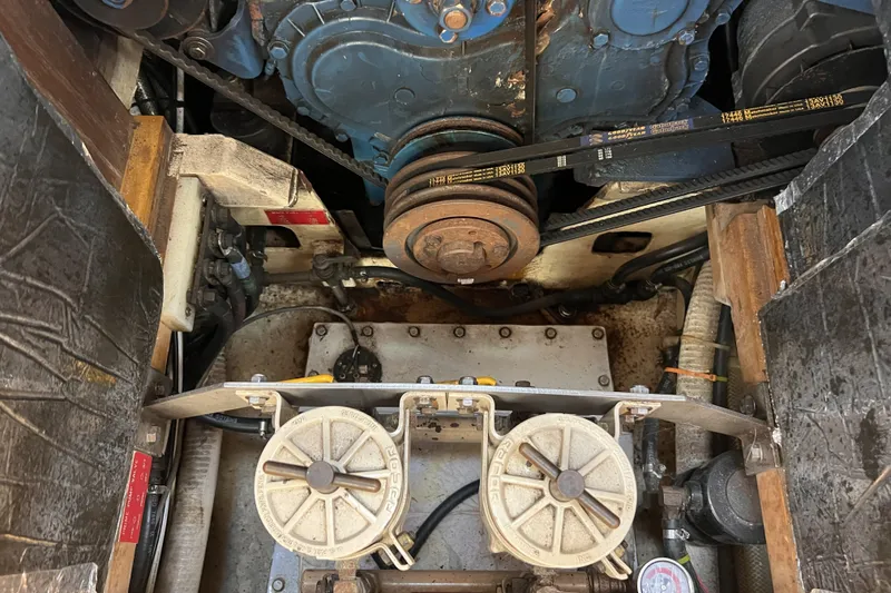 Slide: The Image of Engine compartment of a 1991 Perry 51, showcasing belts and mechanical components. - 100