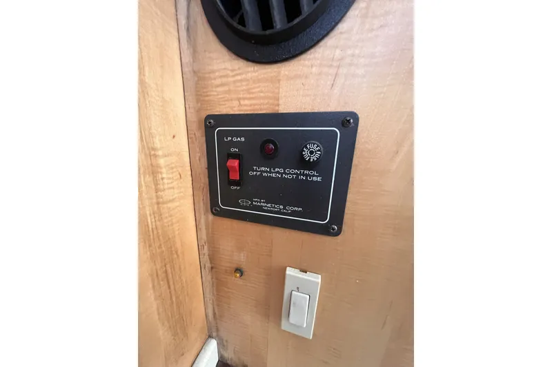 Slide: The Image of Control panel for LP gas system in a 1991 Perry 51 vehicle interior. - 60