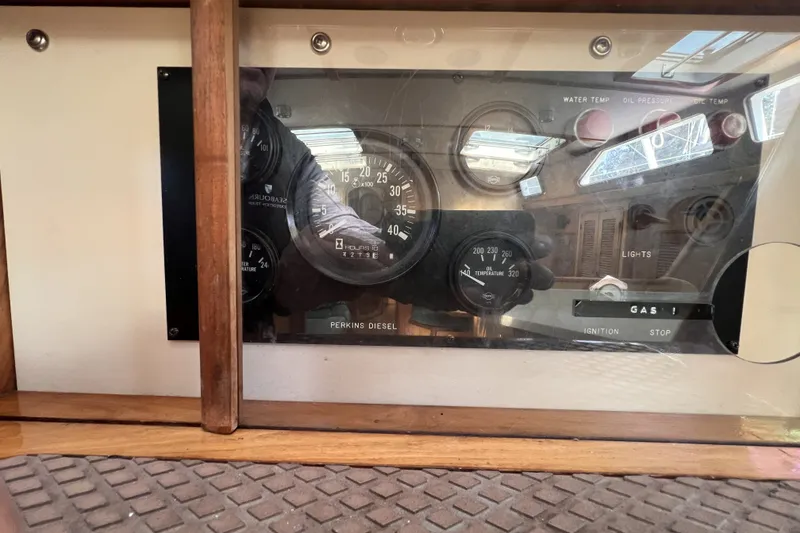 Slide: The Image of Dashboard of a 1991 Perry 51 boat with Perkins Diesel gauges and controls. - 94