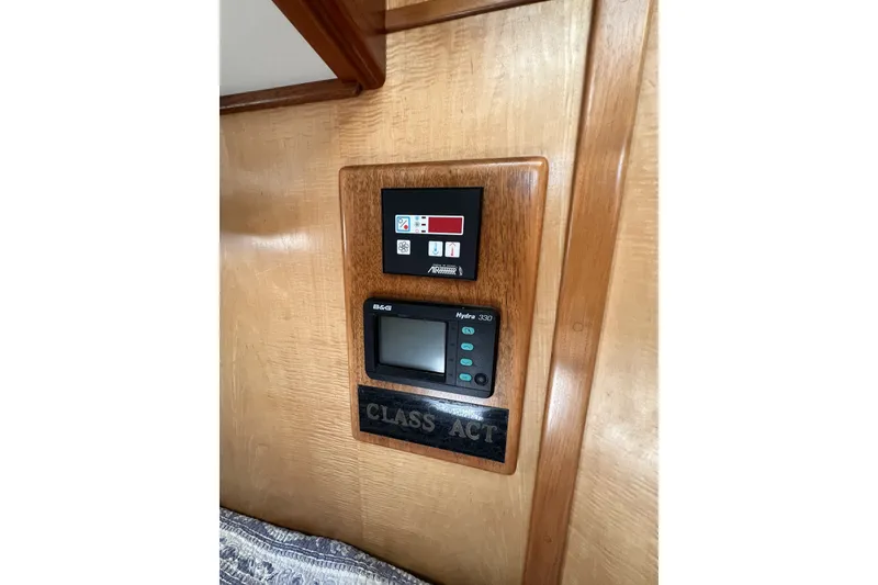 Slide: The Image of Control panel on a 1991 Perry 51 yacht interior, featuring B&G Hydra 330 system. - 61