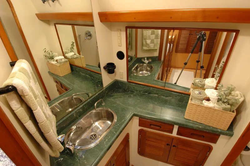 Slide: The Image of Luxurious bathroom with green marble countertop in a 1991 Perry 51 yacht. - 81