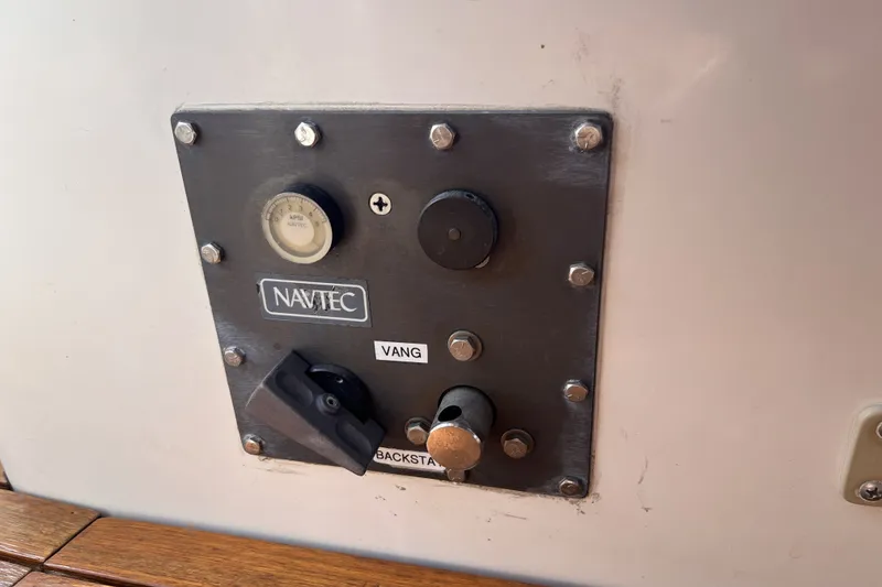 Slide: The Image of Control panel on a 1991 Perry 51 sailboat featuring Navtec vang and backstay adjusters. - 42