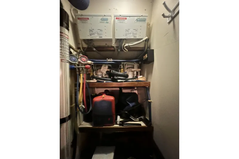 Slide: The Image of Mechanical room with equipment and wiring in a 1991 Perry 51 model. - 105