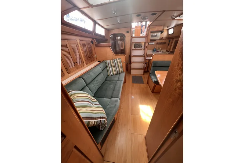 Slide: The Image of Interior of 1991 Perry 51 yacht with cozy seating and wooden finishes. - 54