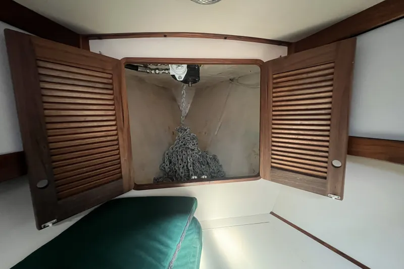 Slide: The Image of Interior of a 1991 Perry 51 sailboat showing anchor chain storage compartment. - 90