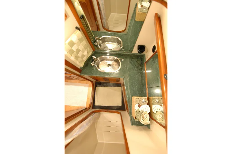 Slide: The Image of Luxurious bathroom interior of 1991 Perry 51 yacht with dual sinks and elegant decor. - 83