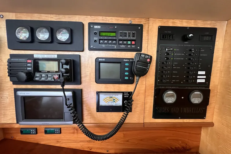 Slide: The Image of Control panel of a 1991 Perry 51 yacht with navigation and communication equipment. - 68