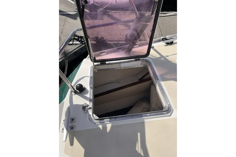 Slide: The Image of Open hatch on 1991 Perry 51 boat deck, revealing interior space. - 51