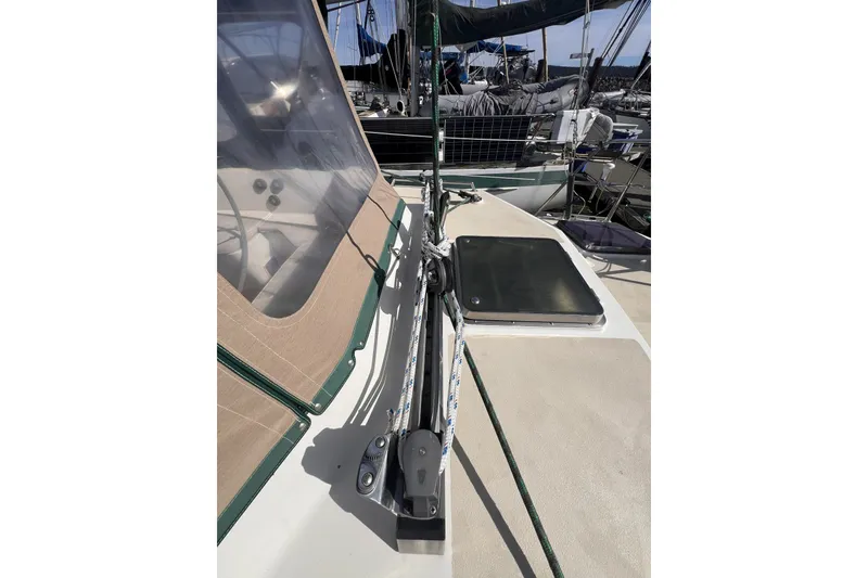 Slide: The Image of Sailboat deck of 1991 Perry 51, featuring rigging and hatch details. - 21