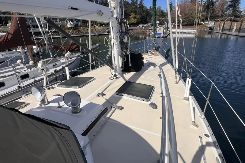 Slide: The Image of Sailboat deck view of 1991 Perry 51, docked in a marina. - 16
