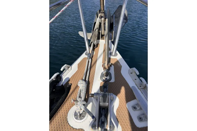 Slide: The Image of Bow of a 1991 Perry 51 sailboat with anchor and ropes on deck. - 14