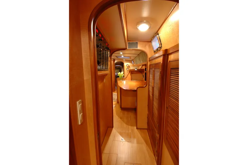 Slide: The Image of Interior of 1991 Perry 51 yacht with wooden finishes and cozy lighting. - 72