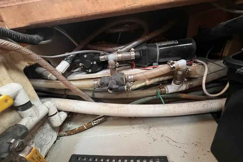 Slide: The Image of Boat plumbing system with hoses and fittings, Perry 51, 1991 model. - 111