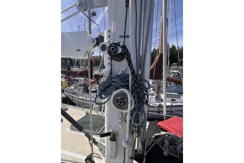 Slide: The Image of Sailboat mast with ropes and pulleys on a 1991 Perry 51 yacht. - 24
