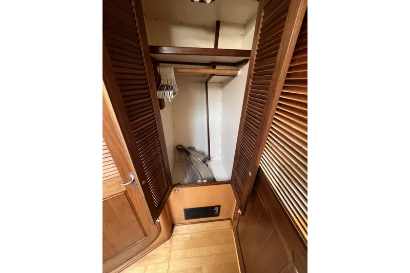 Slide: The Image of Wooden closet interior with hangers, Perry 51, 1991 model. - 93