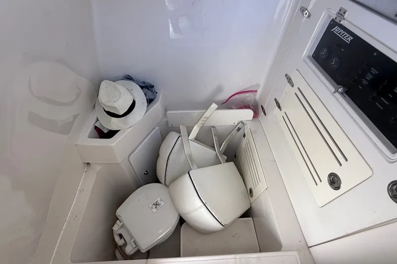 Slide: The Image of Interior of a 2015 Jupiter 34 FS boat with storage compartments and accessories. - 20