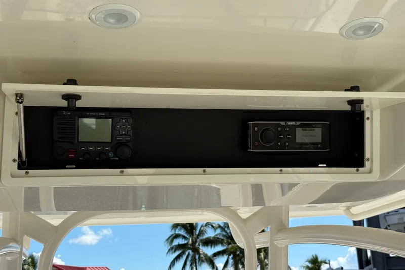 Slide: The Image of 2015 Jupiter 34 FS boat electronics panel with radio and control system. - 31
