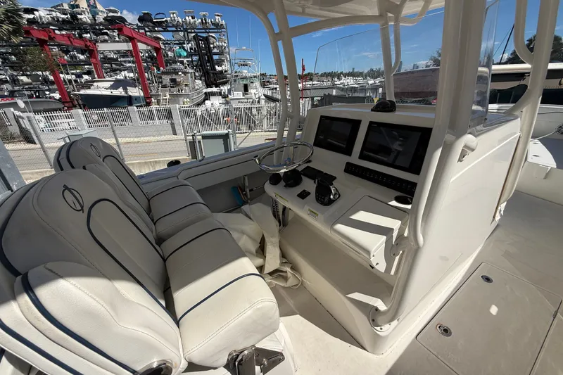 Slide: The Image of 2015 Jupiter 34 FS boat interior with helm, seats, and navigation equipment. - 37