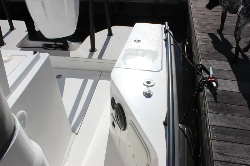 Slide: The Image of 2019 Axopar Brabus 28 Cabin boat docked, showcasing sleek deck design and mooring details. - 20