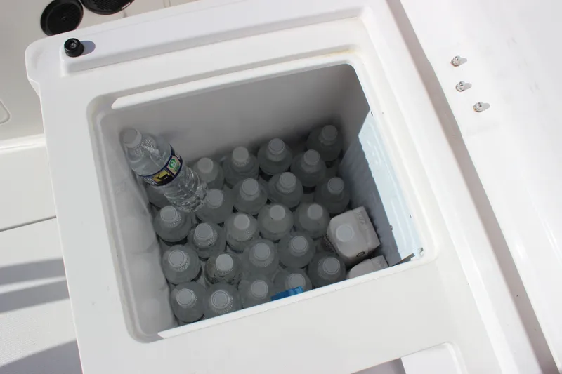 Slide: The Image of Cooler filled with water bottles on 2019 Axopar Brabus 28 Cabin boat. - 24