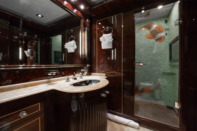 Slide: The Image of Luxurious bathroom on 2009 Mangusta 165 yacht with elegant fixtures and mosaic shower design. - 45