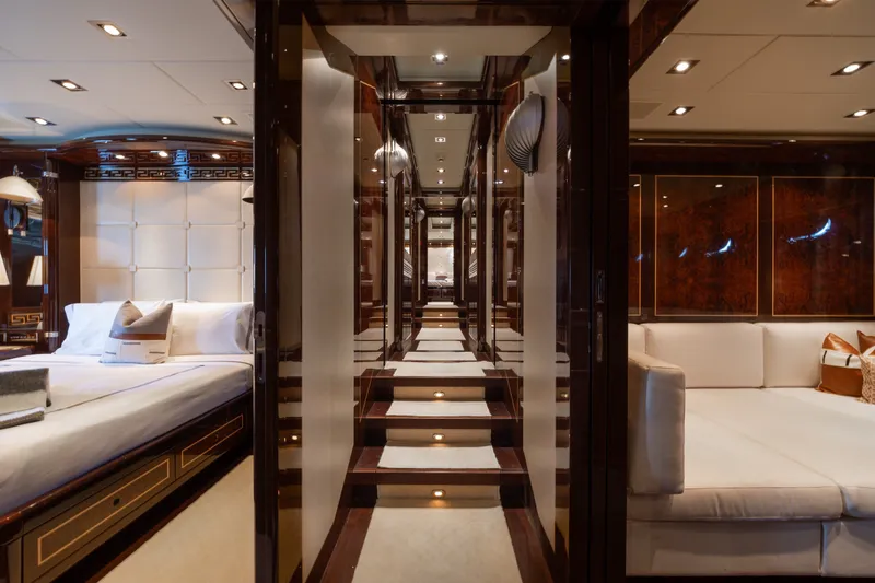 Slide: The Image of Luxurious interior of 2009 Mangusta 165 yacht with elegant wood finishes and plush seating. - 51