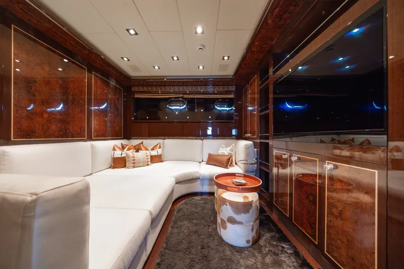 Slide: The Image of Luxurious interior of 2009 Mangusta 165 yacht with elegant wood paneling and plush seating. - 37
