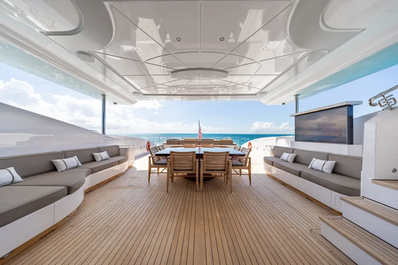 Slide: The Image of Luxurious 2009 Mangusta 165 yacht deck with elegant seating and ocean view. - 12
