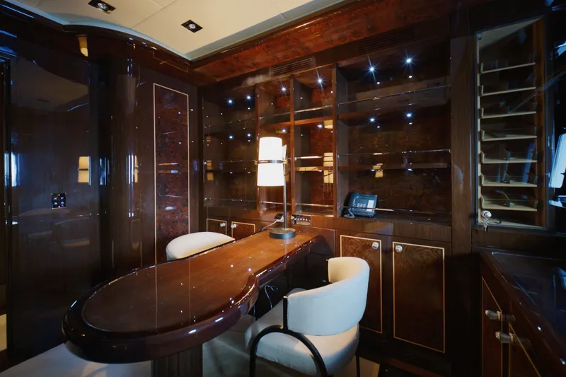 Slide: The Image of Luxurious interior of 2009 Mangusta 165 yacht with elegant wood finishes and modern furnishings. - 36