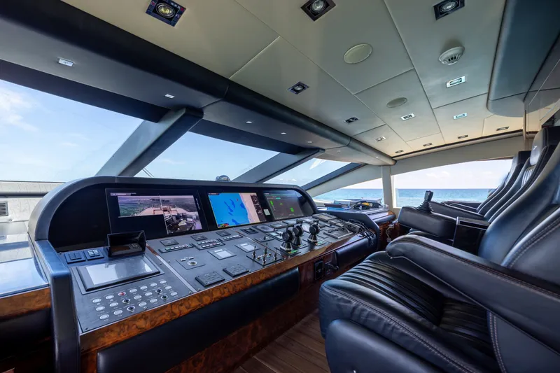 Slide: The Image of Luxurious Mangusta 165 yacht cockpit interior with advanced navigation controls, 2009 model. - 25