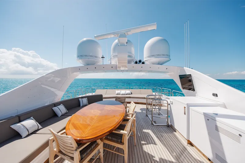 Slide: The Image of Luxurious deck of 2009 Mangusta 165 yacht with ocean view and elegant seating area. - 59