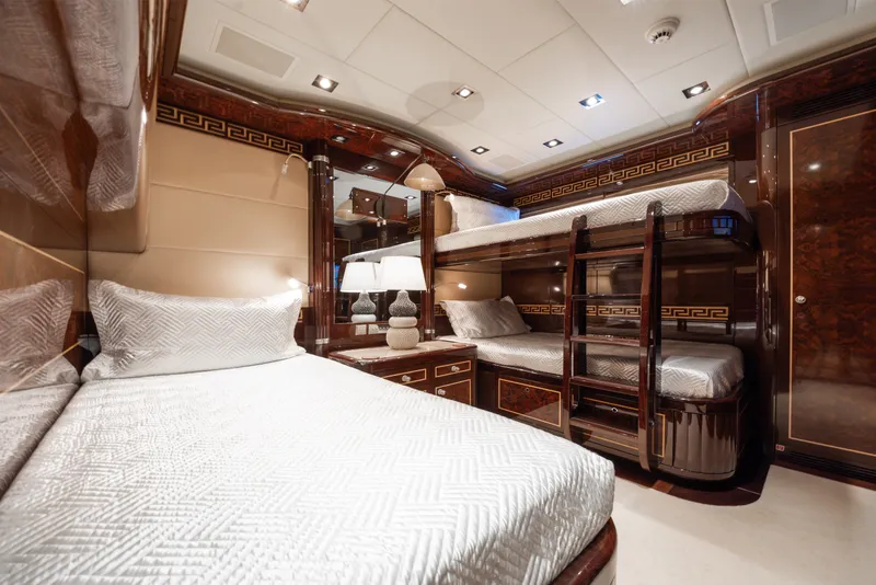 Slide: The Image of Luxurious interior of 2009 Mangusta 165 yacht with elegant bunk beds and rich wood finishes. - 44