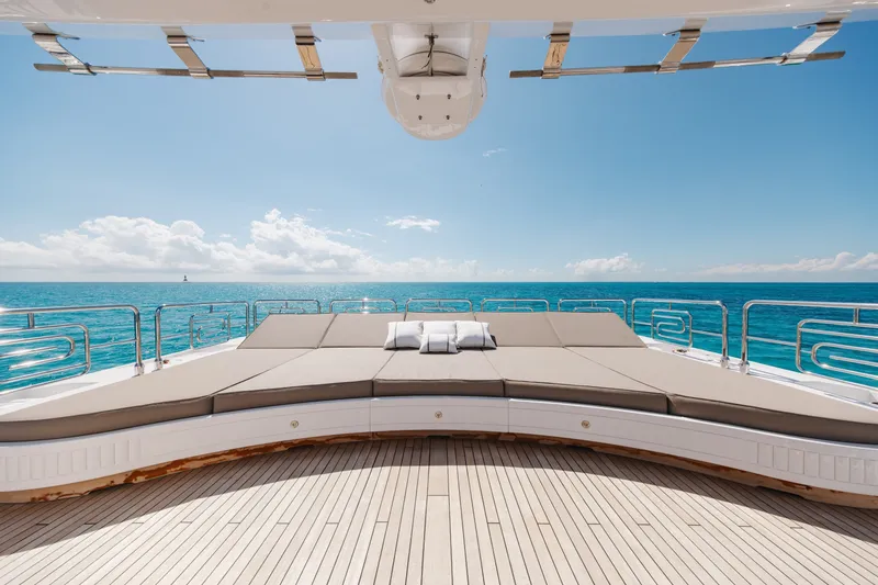 Slide: The Image of Luxurious 2009 Mangusta 165 yacht deck with sun loungers and ocean view. - 57