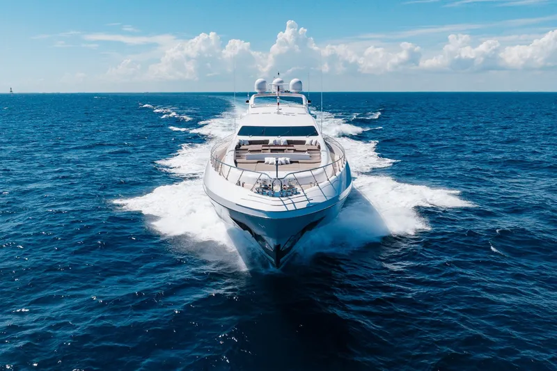 Slide: The Image of Luxurious 2009 Mangusta 165 yacht cruising on open ocean under clear blue skies. - 6