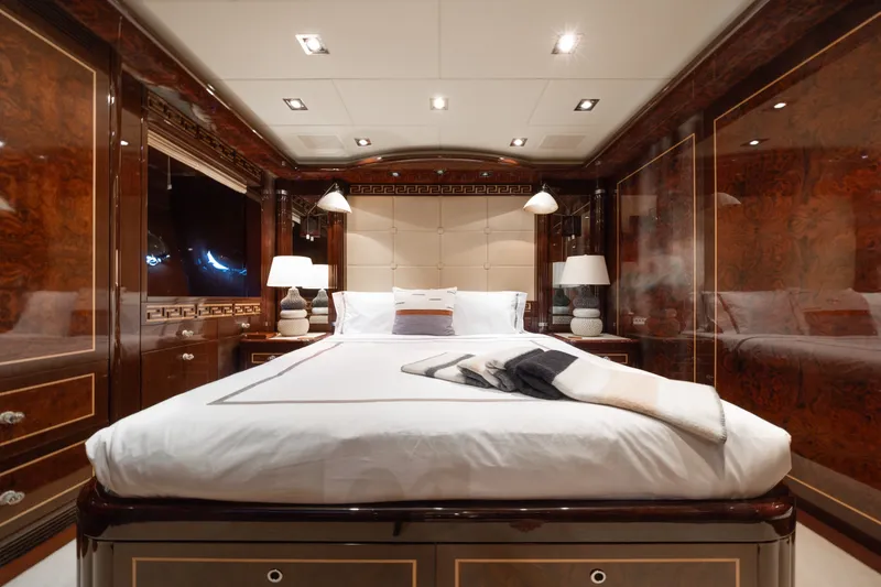 Slide: The Image of Luxurious bedroom interior of 2009 Mangusta 165 yacht with elegant wood paneling. - 49