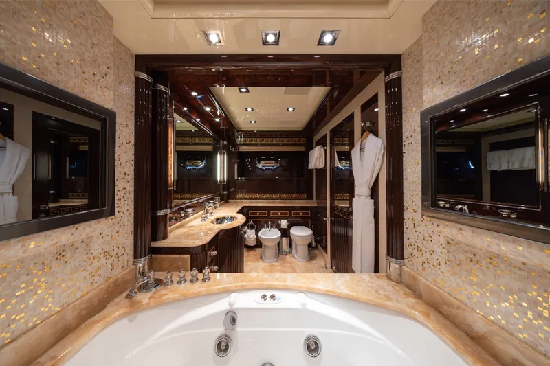 Slide: The Image of Luxurious bathroom interior on 2009 Mangusta 165 yacht, featuring elegant fixtures and marble accents. - 33