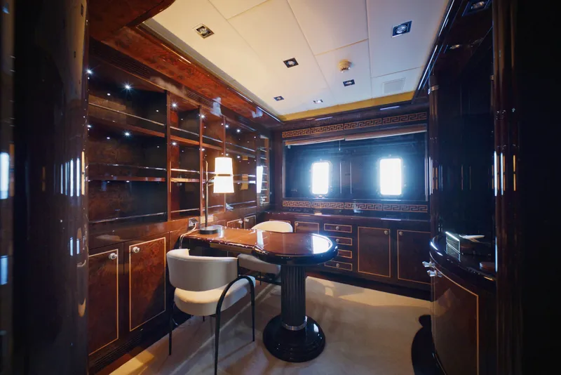Slide: The Image of Luxurious interior of 2009 Mangusta 165 yacht with elegant wood finishes and modern furnishings. - 35