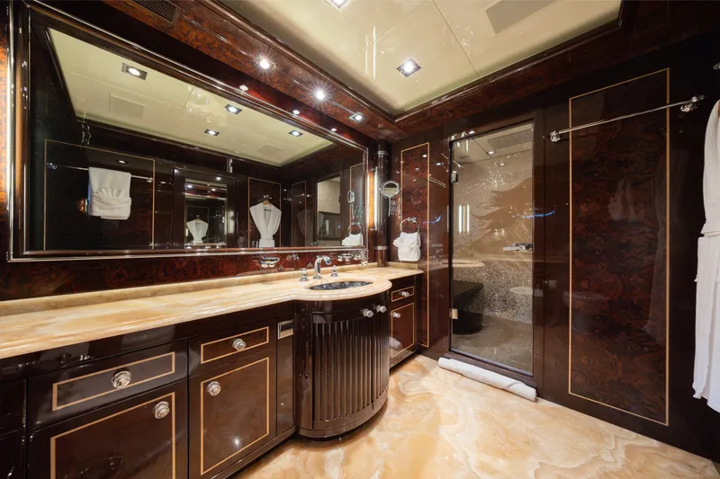 Slide: The Image of Luxurious bathroom interior on 2009 Mangusta 165 yacht with elegant wood and marble finishes. - 32