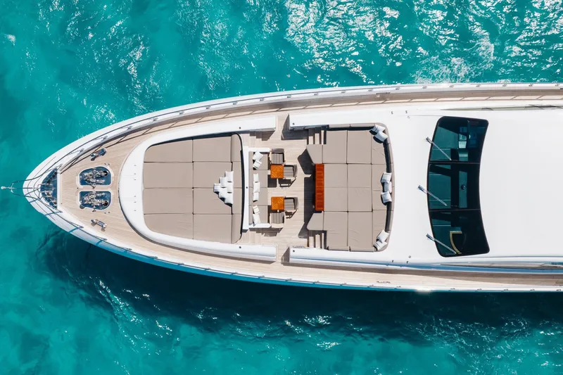 Slide: The Image of Aerial view of 2009 Mangusta 165 yacht on turquoise water. - 8