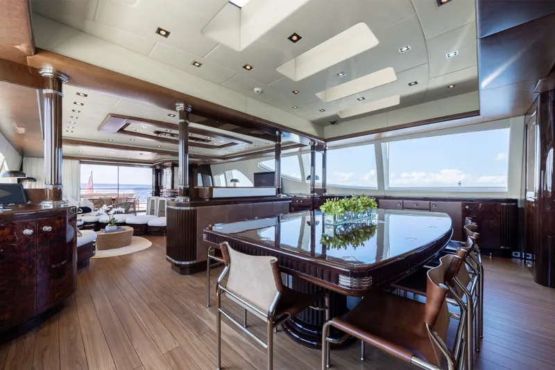 Slide: The Image of Luxurious interior of 2009 Mangusta 165 yacht with elegant dining area and panoramic windows. - 23