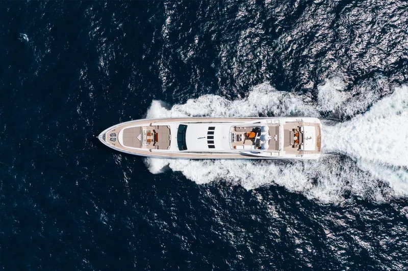 Slide: The Image of Aerial view of 2009 Mangusta 165 yacht cruising on open sea. - 9