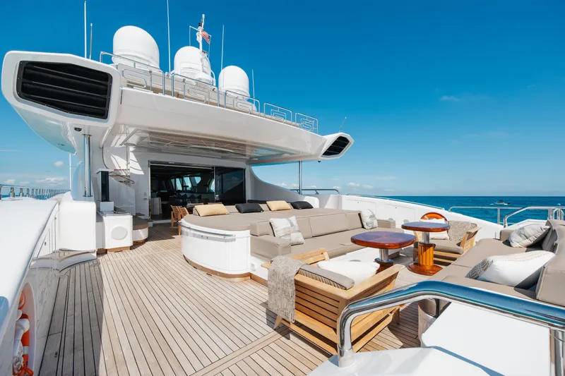 Slide: The Image of Luxurious 2009 Mangusta 165 yacht deck with elegant seating and ocean view. - 10