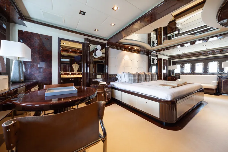 Slide: The Image of Luxurious interior of 2009 Mangusta 165 yacht, featuring elegant bedroom with modern furnishings. - 28