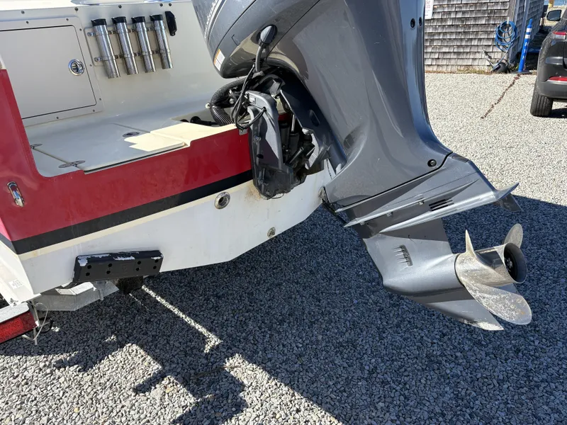 Slide: The Image of The image shows the stern of a 2020 Rossiter 20 boat with an outboard motor. - 13
